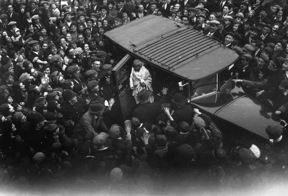 Crowds gather to welcome Mahatma Gandhi on a visit to the East End of London, 22 September 1931. Public Domain.